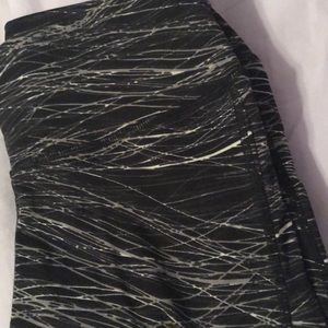 black designed leggings with mesh along the sides